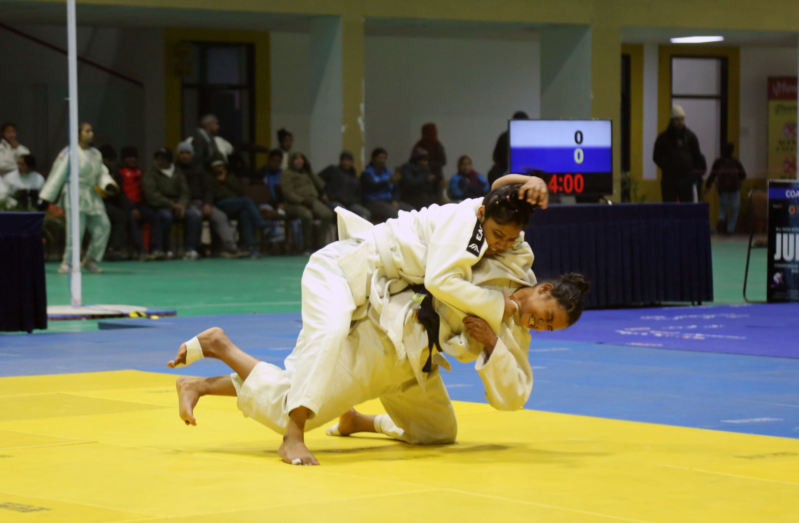 Players-locked-up-in-a-judo-match-during-All-India-Inter-University-Judo-Women-Championship-2022-23-Trophy-at-Lovely-Professional-University-campus